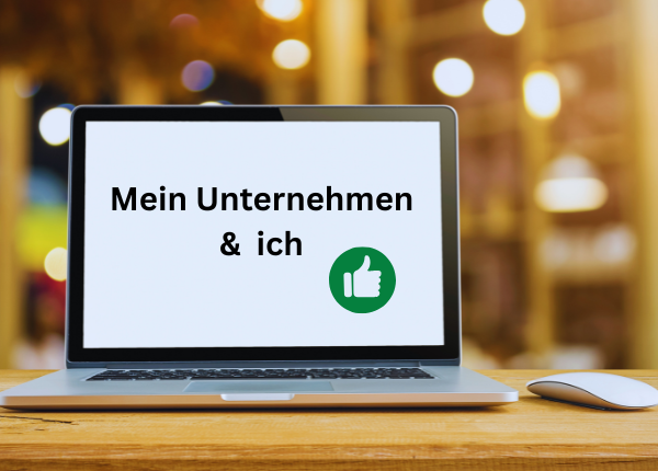 Auf dem Bildschirm eines Laptops steht "Mein Unternehmen & ich"